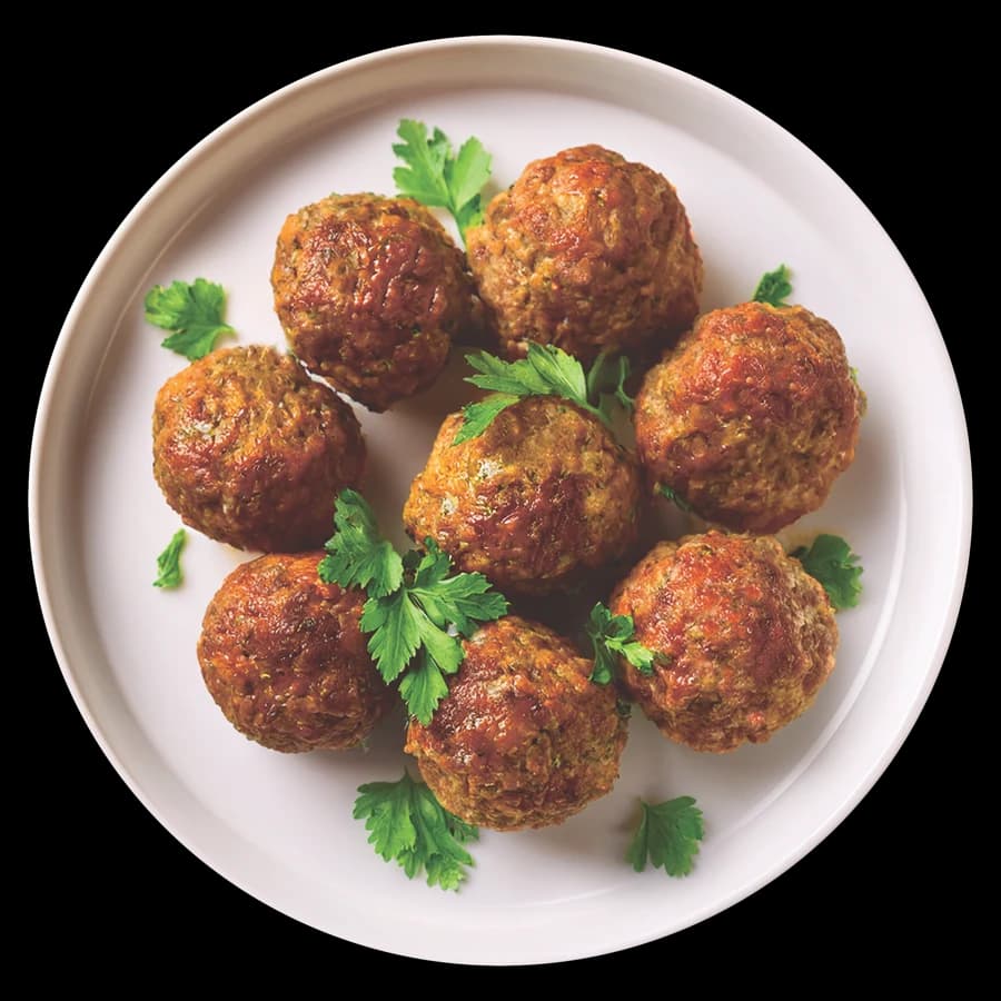 Lentil mushroom walnut meatballs garnished with fresh herbs